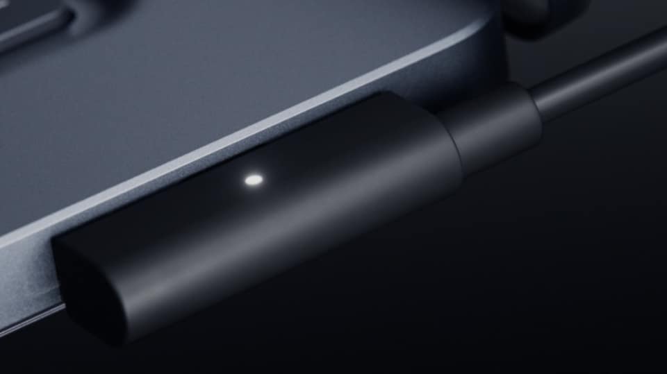 How is Microsoft's Magnetic Connect different from Apple's MagSafe for MacBooks?